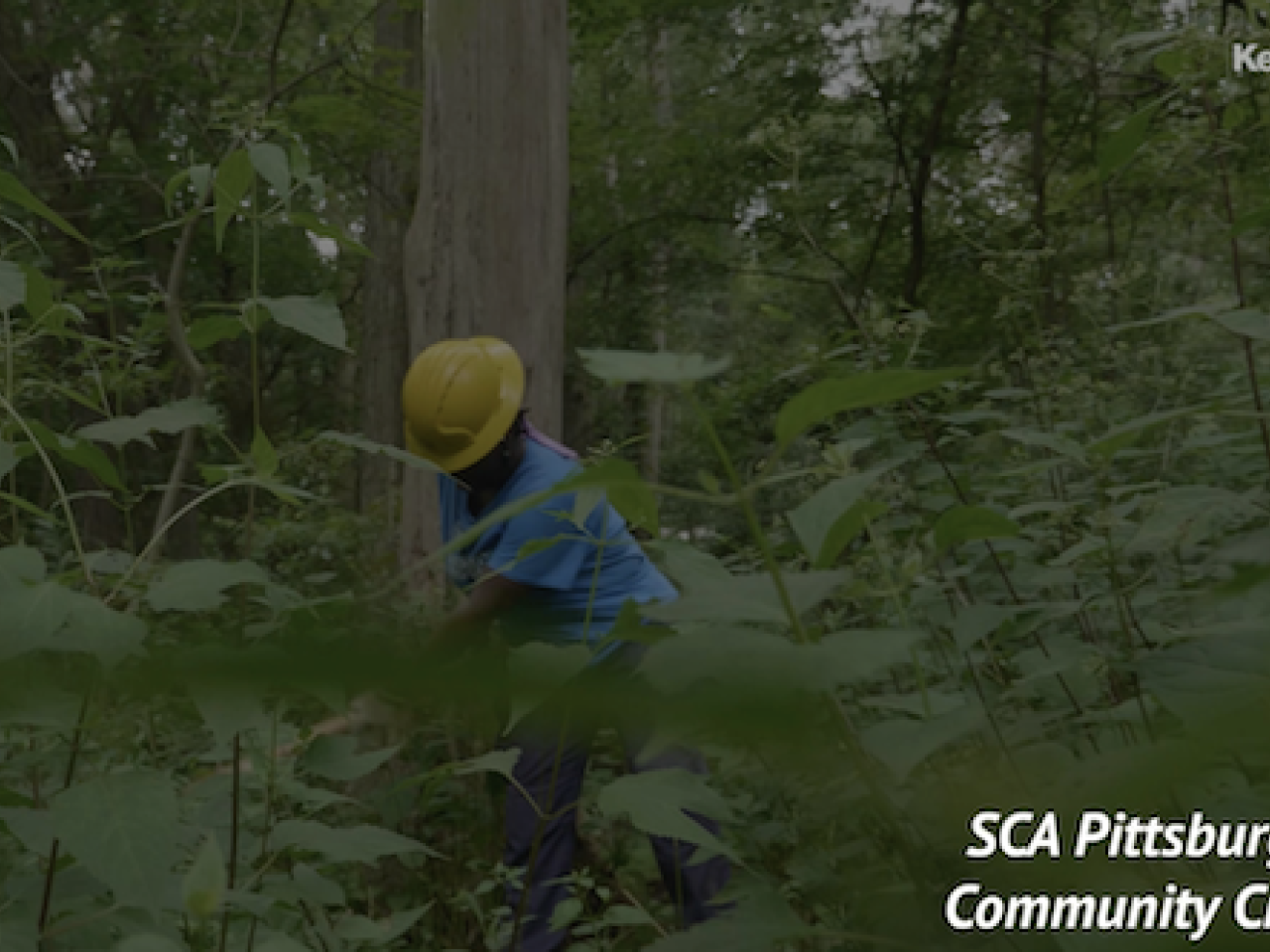 KeyBank SCA Pittsburgh community crew member working in a green space.