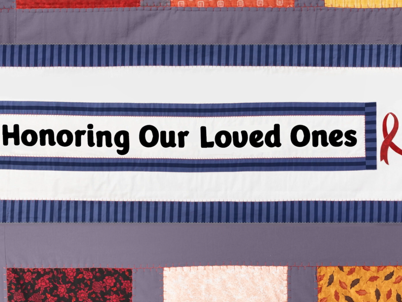 A quilt with "Honoring Our Loved Ones" central.