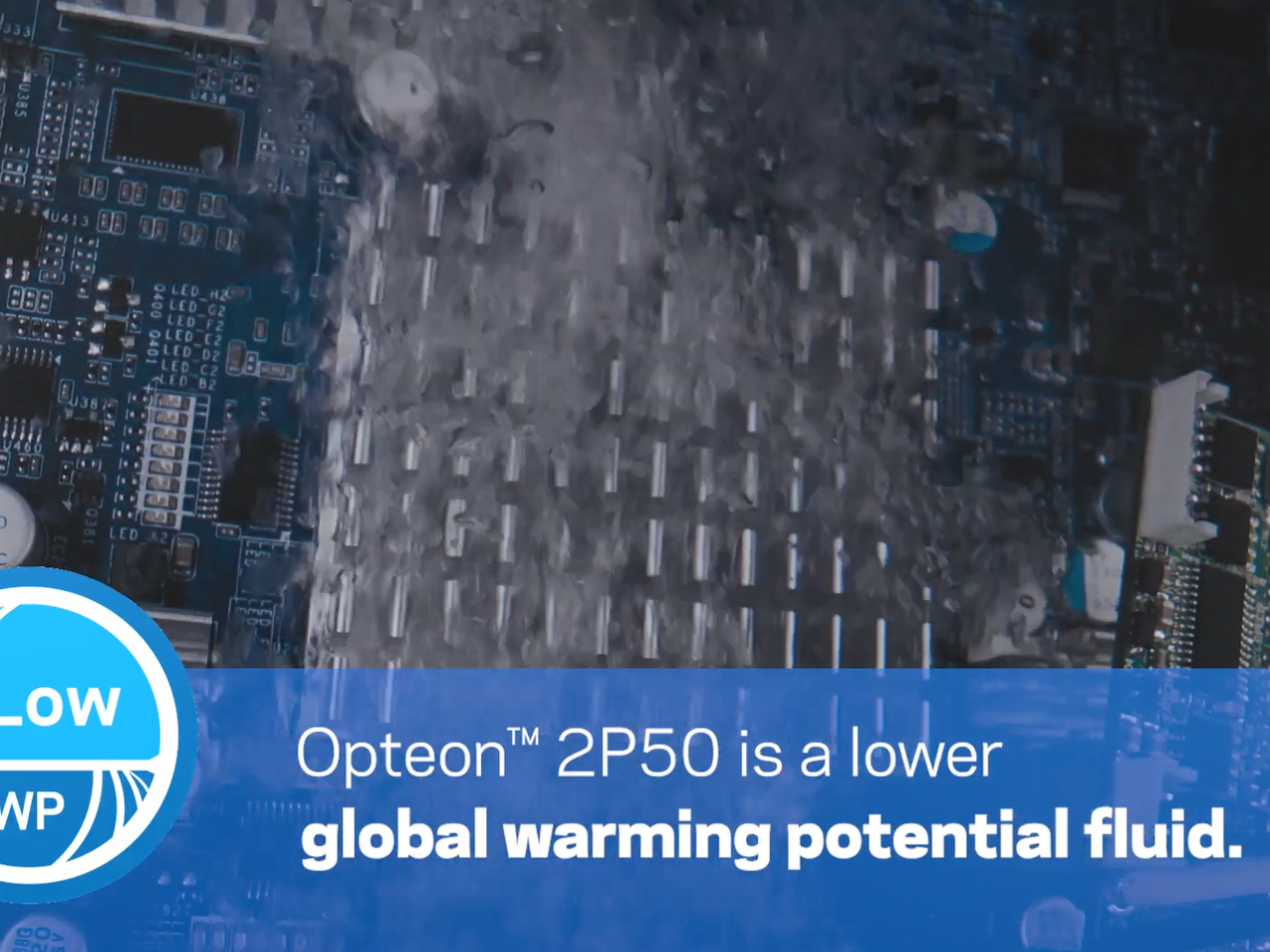 A computer part in a bubbling liquid. "Opteon 2P50 is a lower global warming potential fluid."