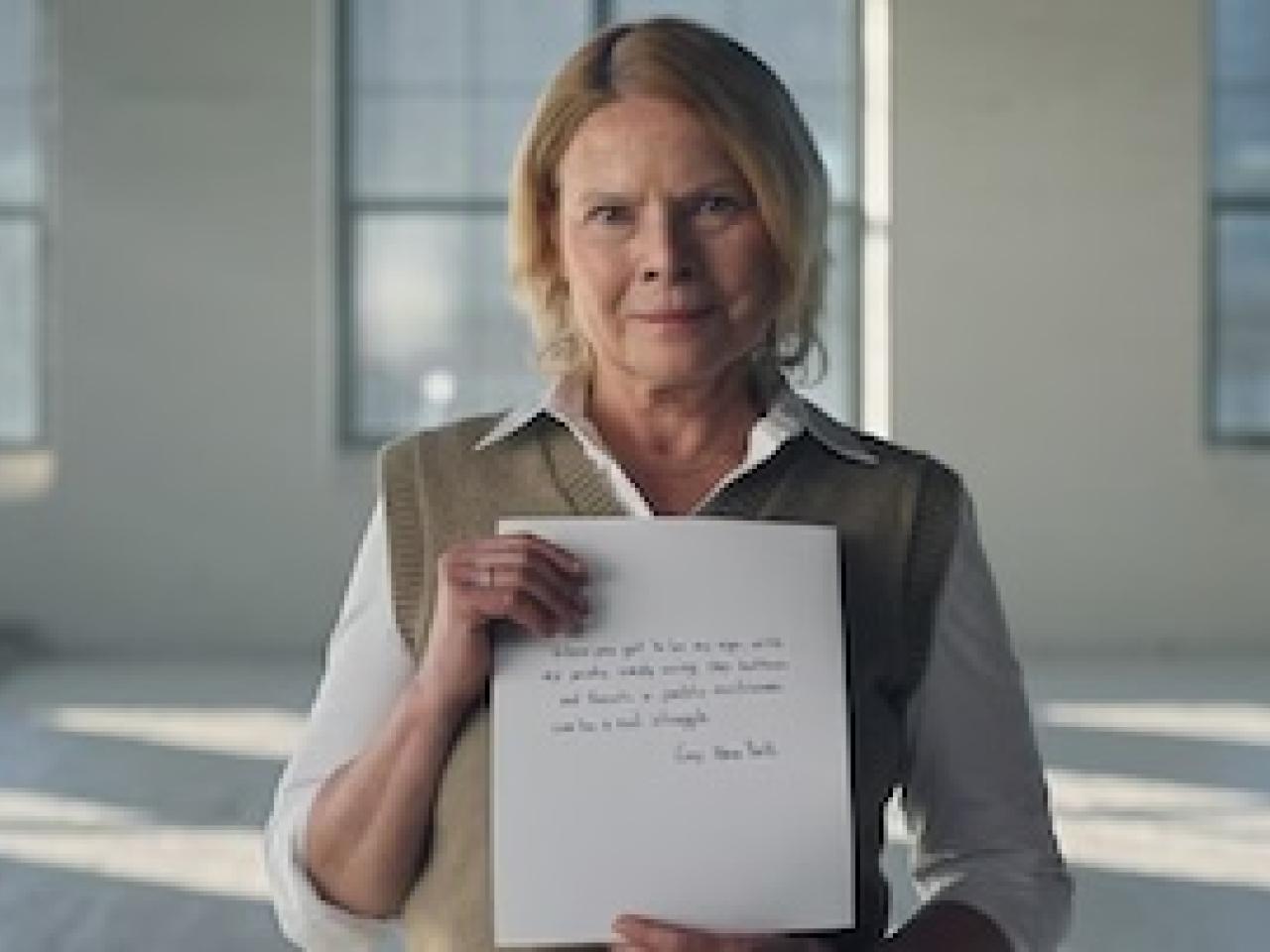Gay holding her letter.