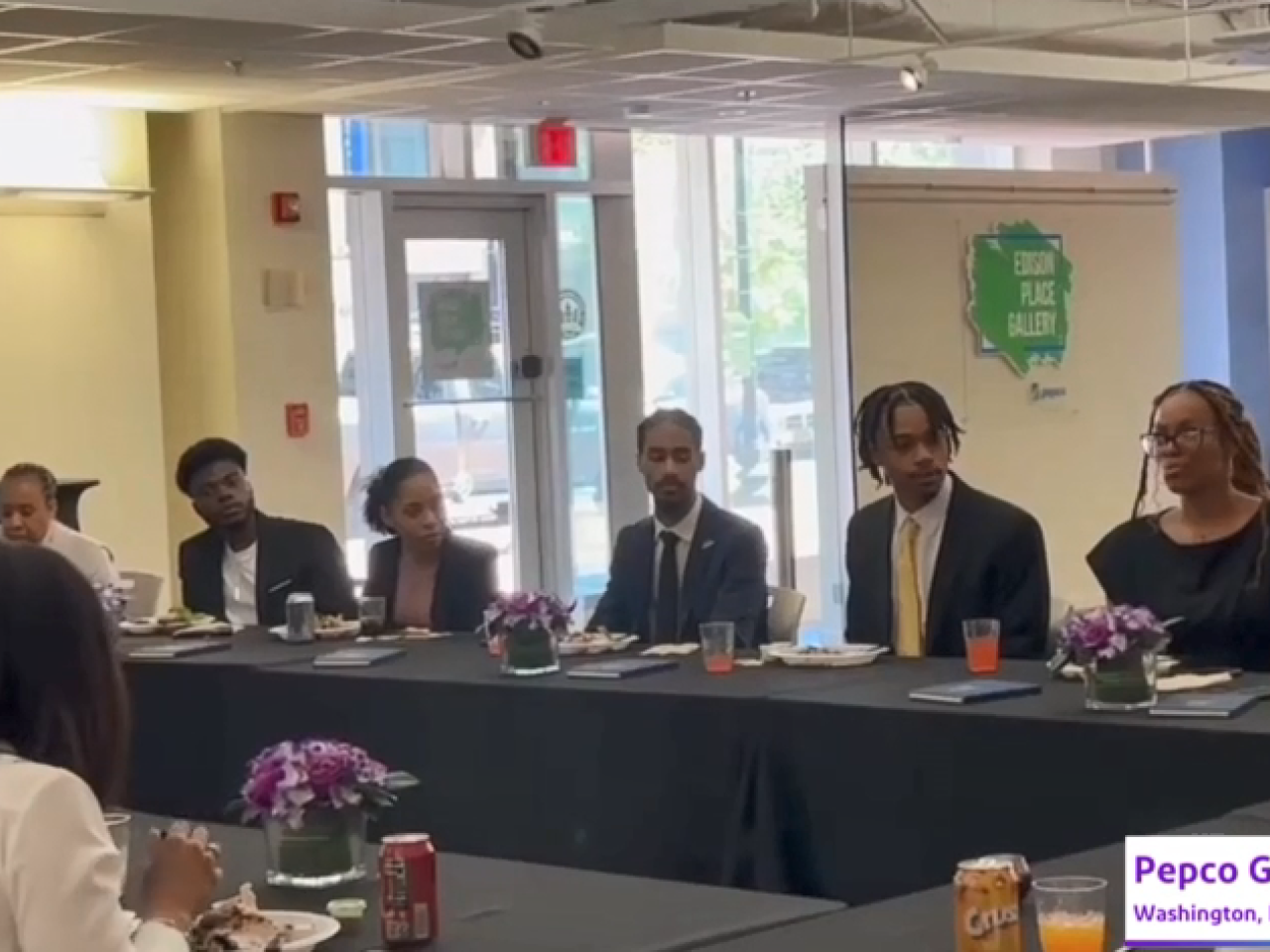 Students seated at a long table.