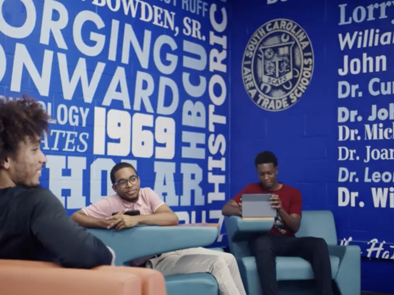 3 students sitting