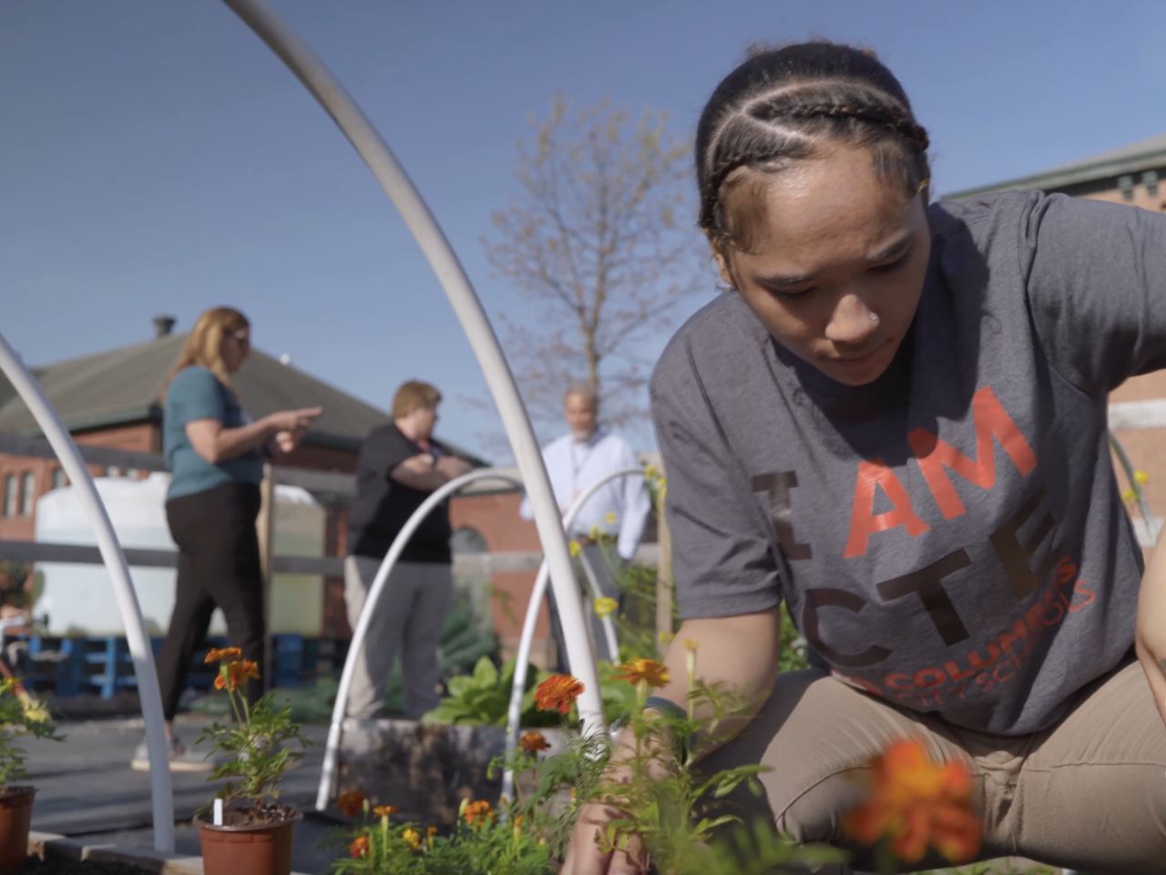 Students working in a garden