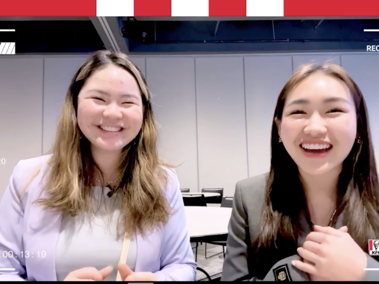 girls smiling into a screen