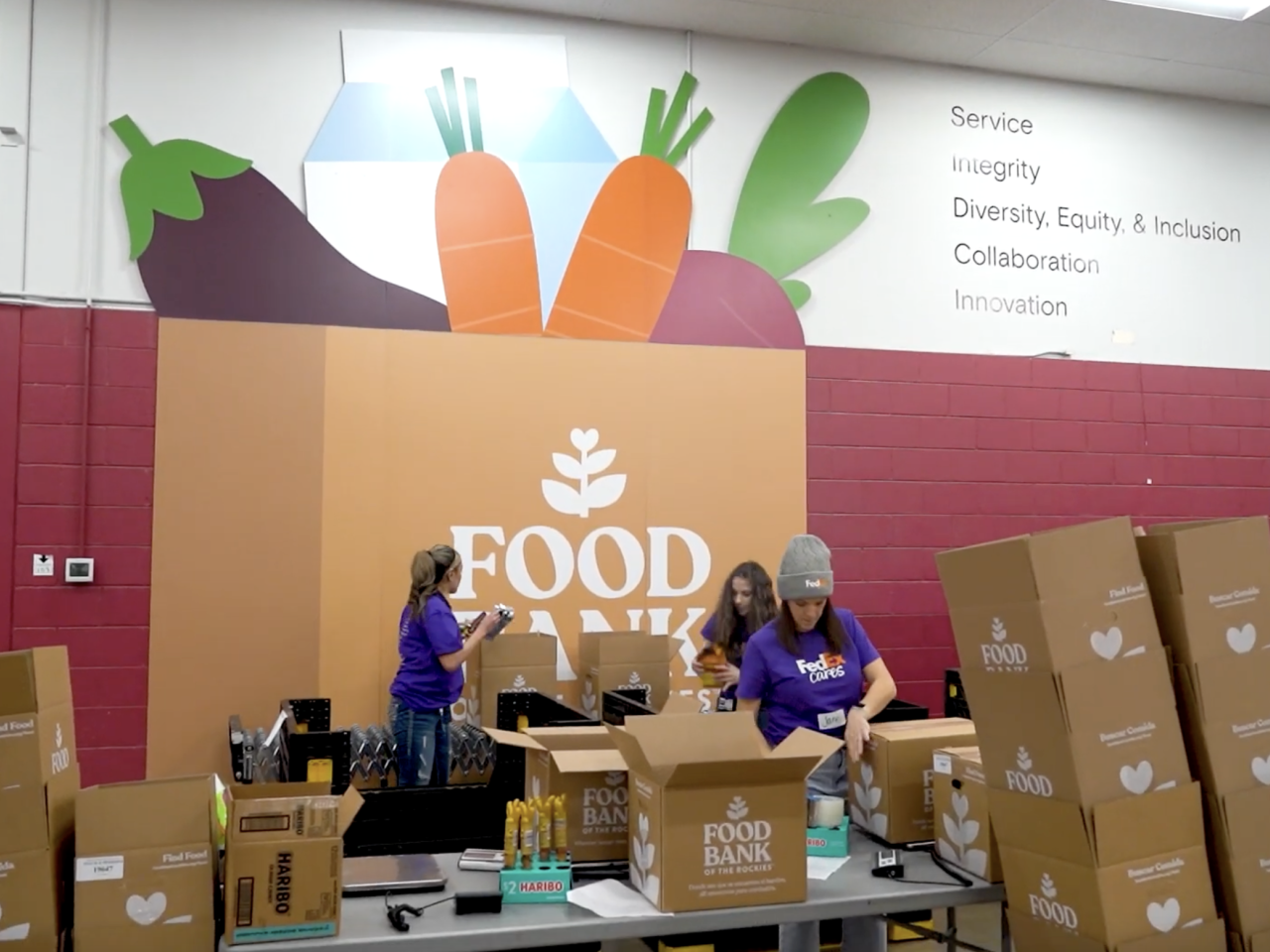 Volunteers packing up boxes at the Food Bank