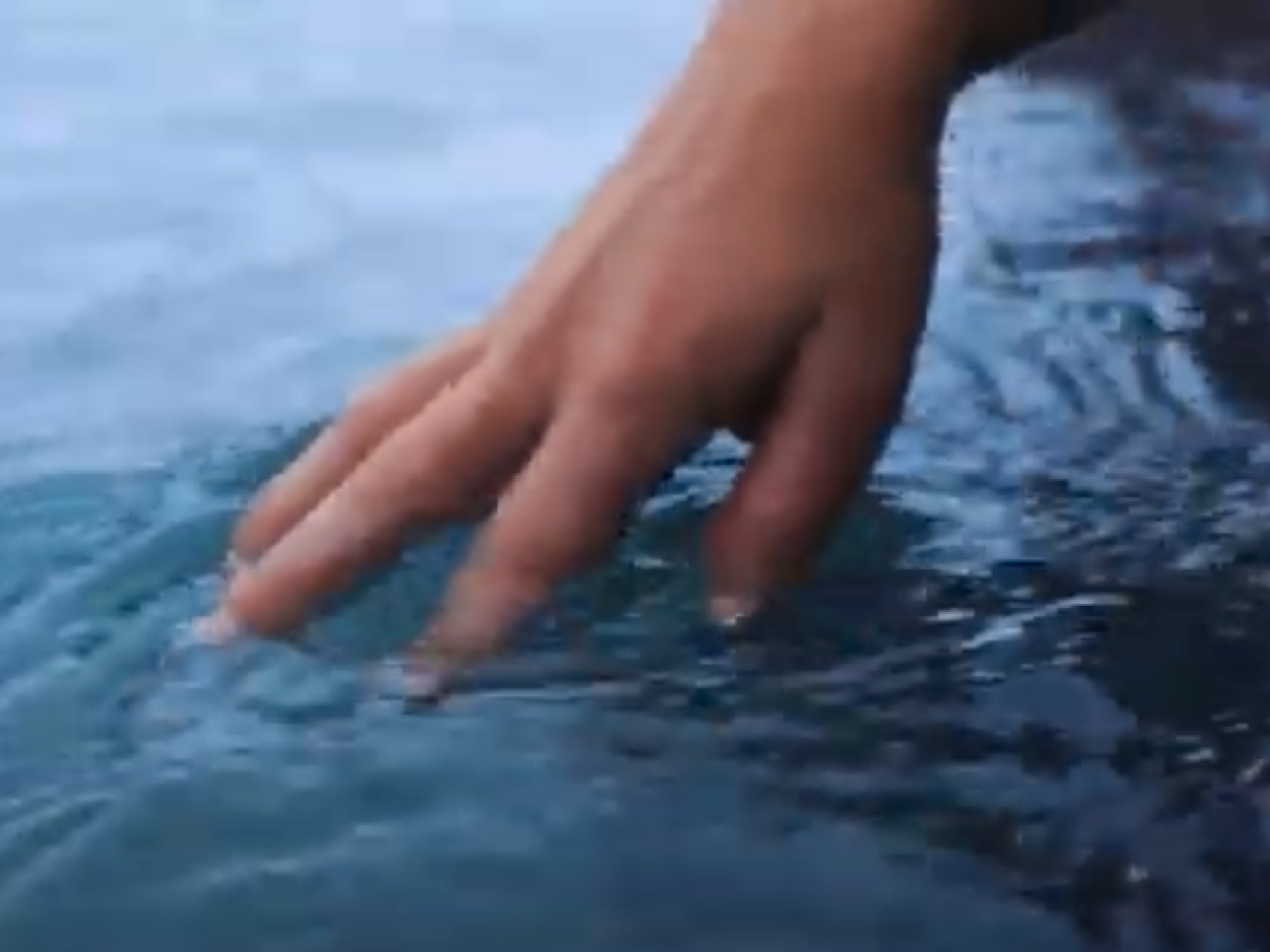 A hand in water