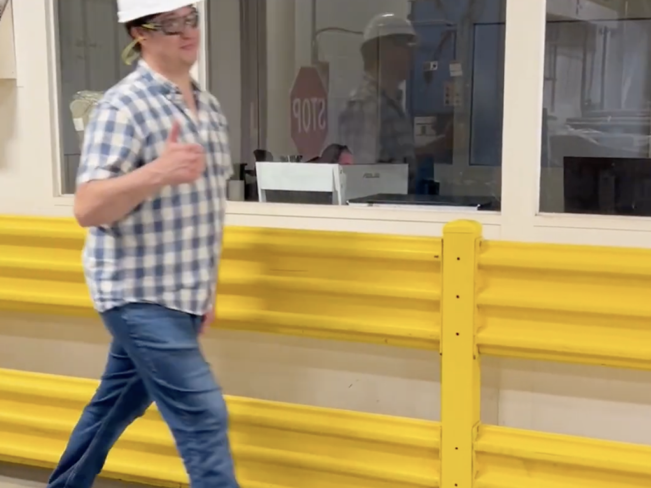 Factory worker giving thumbs up
