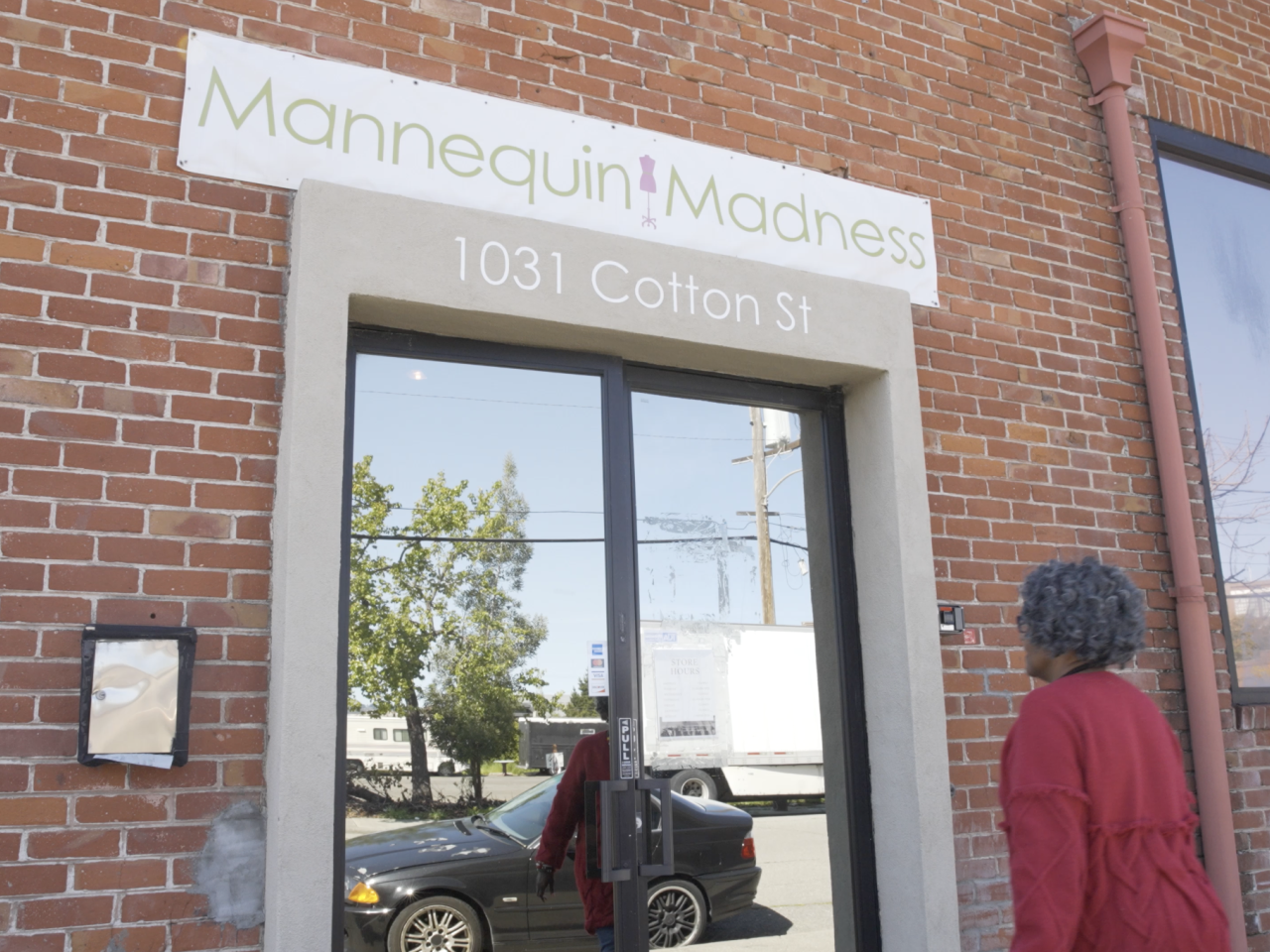 Person walking into Mannequin Madness