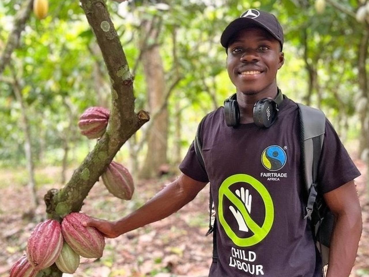 Felix, a cocoa farmer in Ghana, takes viewers to his farm and shows how to break open a cocoa pod to reveal the beans, which are encased in a sweet fruit.