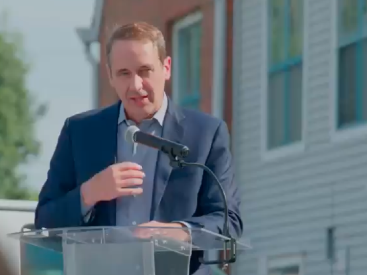 A person speaking at a podium