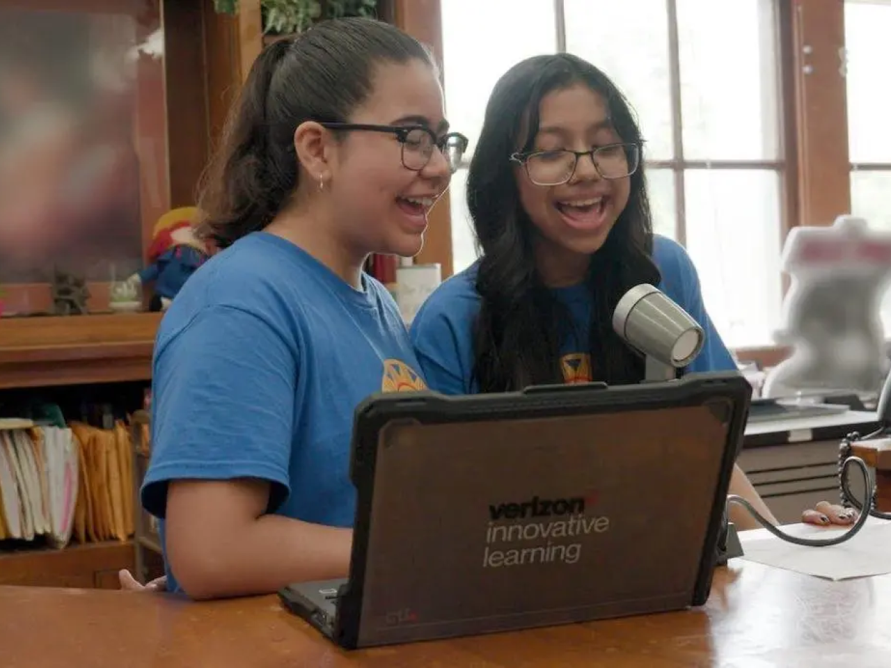 Abril Contreras-Reyes and Paulina Martinez-Garcia deliver the morning announcements at Academia de Lenguaje y Bellas Artes (ALBA).