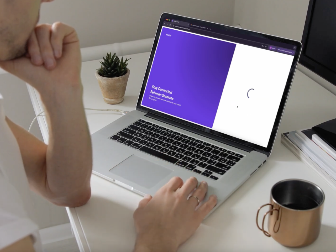 Person looking at open laptop