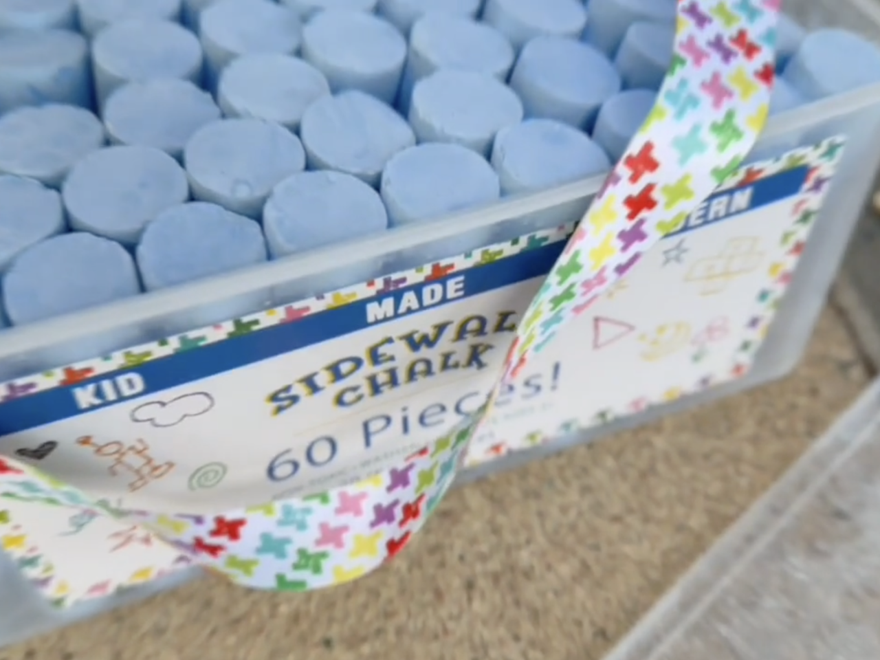 Box of sidewalk chalk.