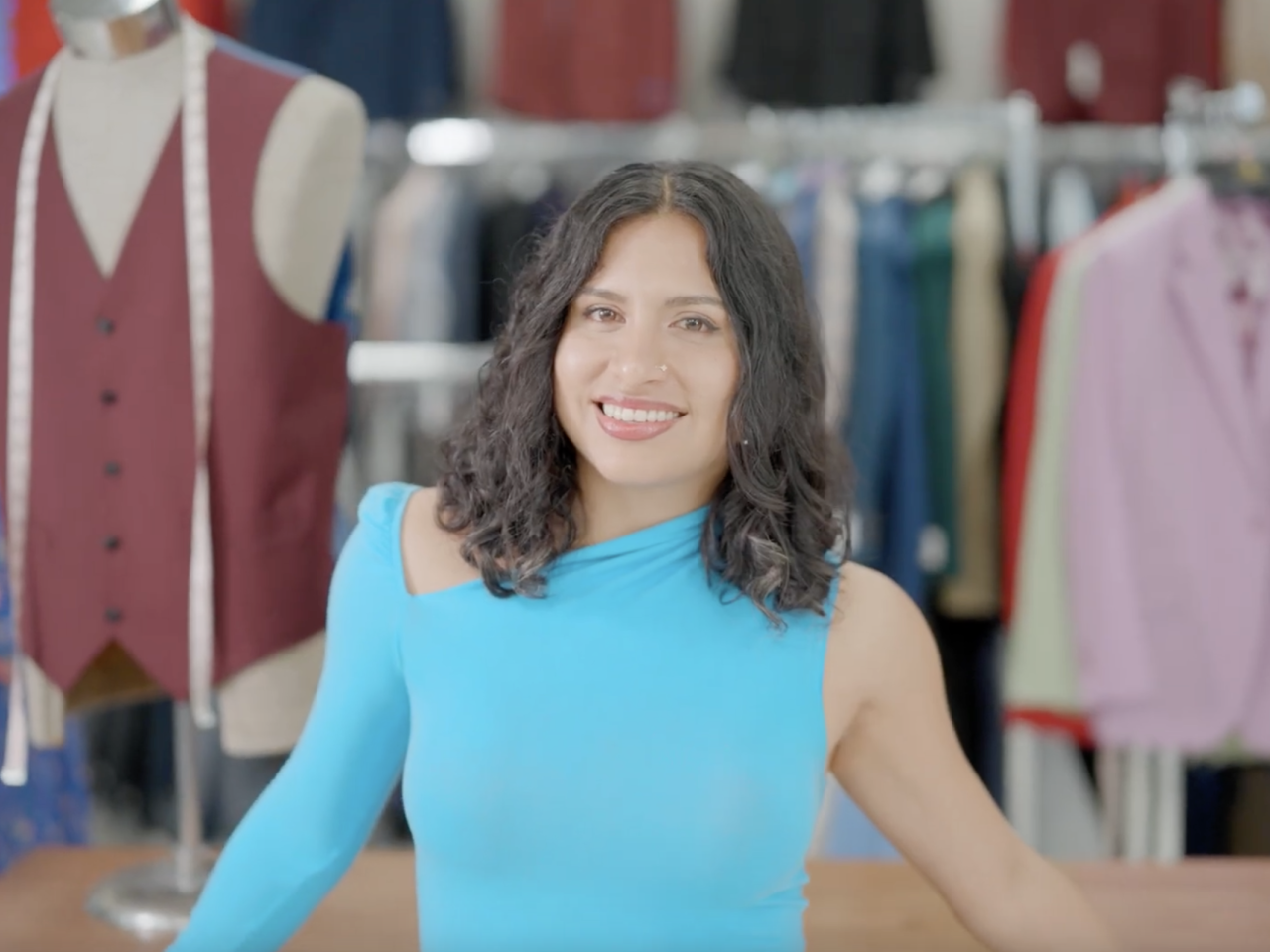 Naomi Romo in her family’s Miami clothing store, Anghelo’s Suit & Tux. Photo credit: Maggie M. Bailey