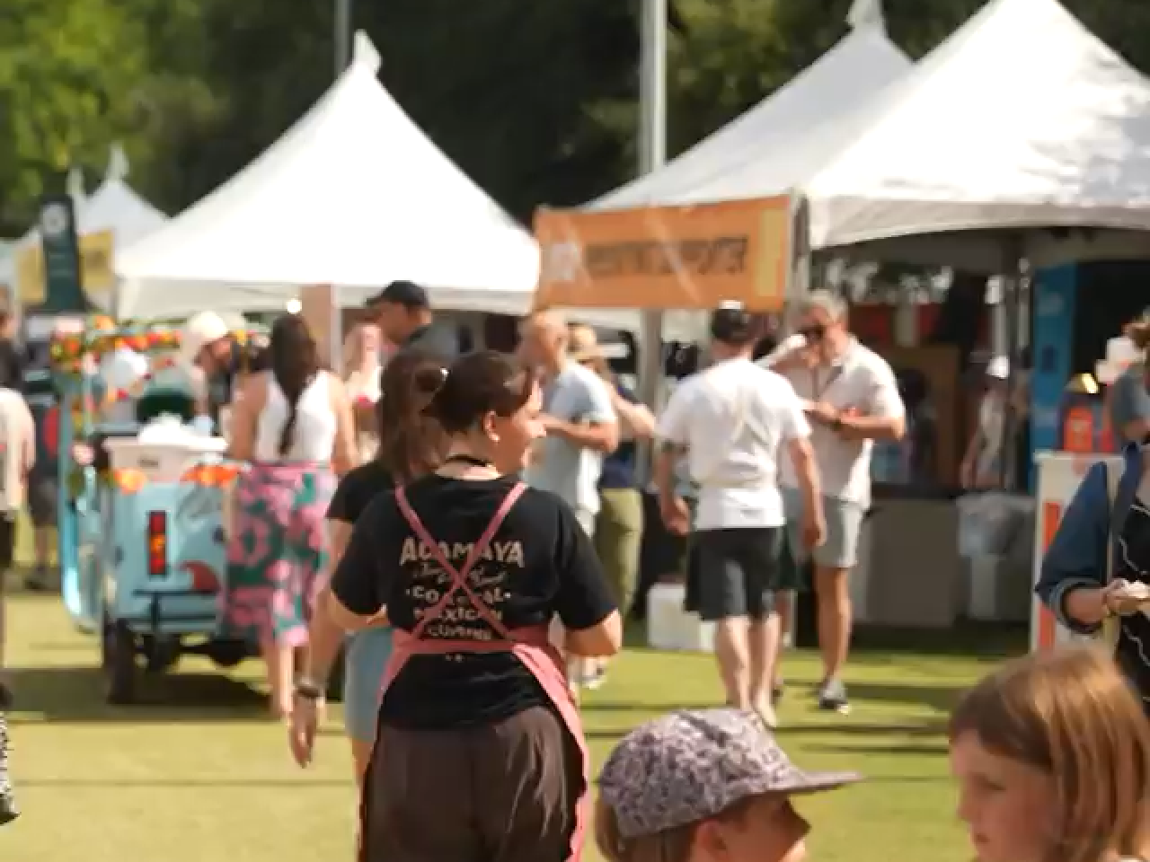 Food trucks and people at a fair