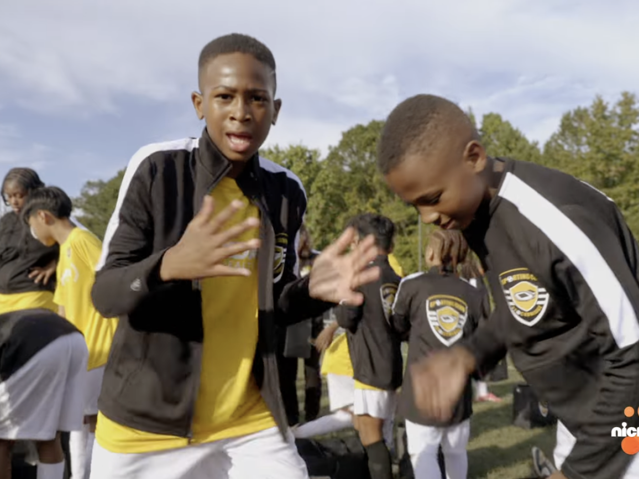 Young athletes on a playing field.