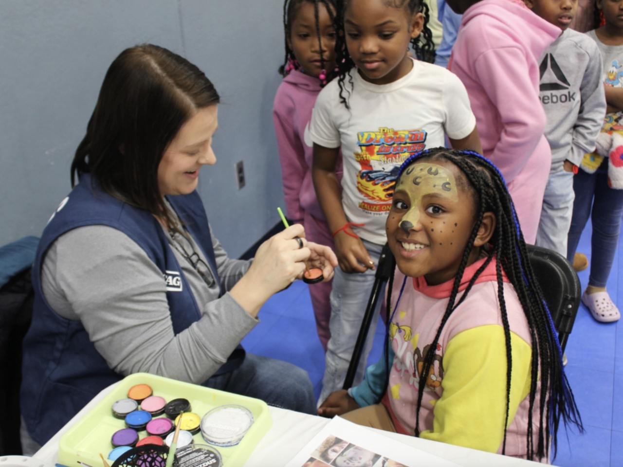 Children at a face painting activity