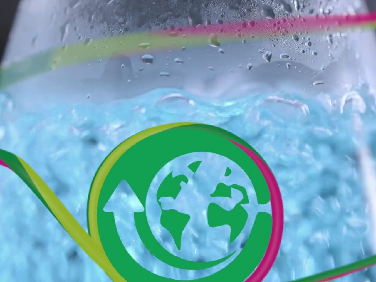 Image of a science beaker with bubbling liquid and a green graphic resembling the earth.