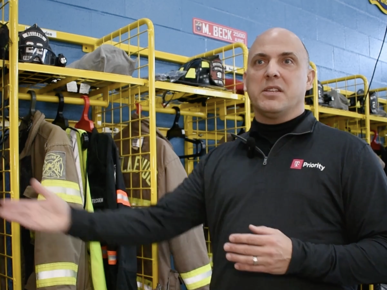 First responder in front of firefighting equipment