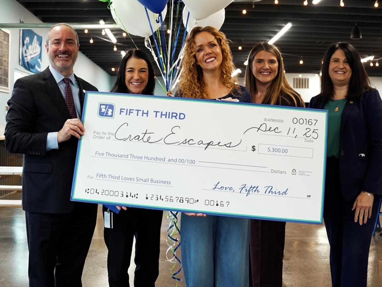 Crate Escapes Dog Park receiving grant check from Fifth Third
