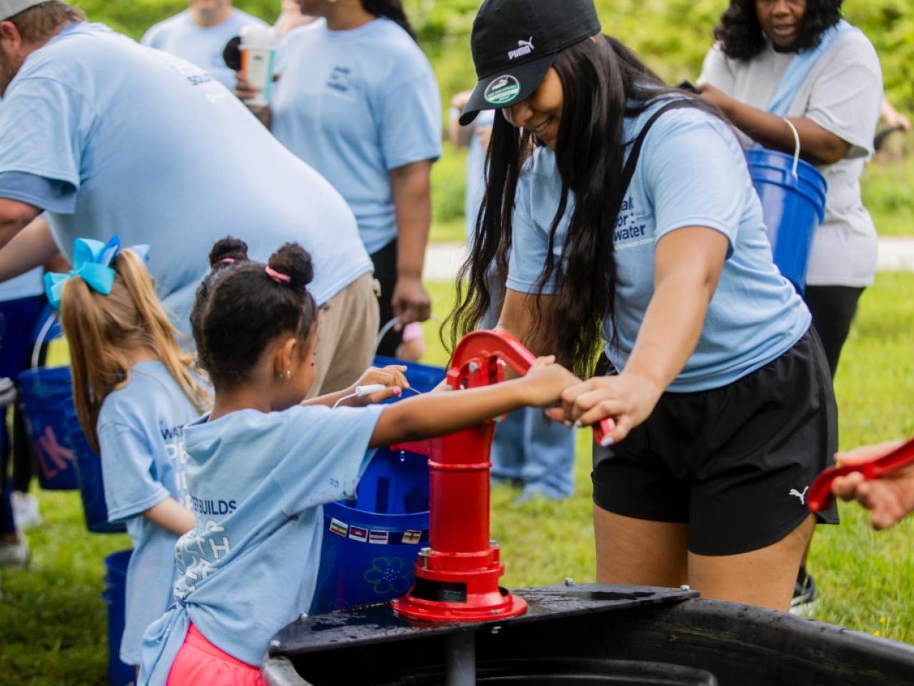 Pumping water at Walk for Water