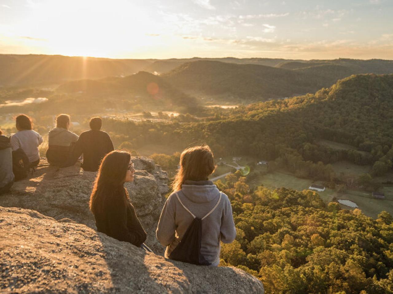 people watching the sunset
