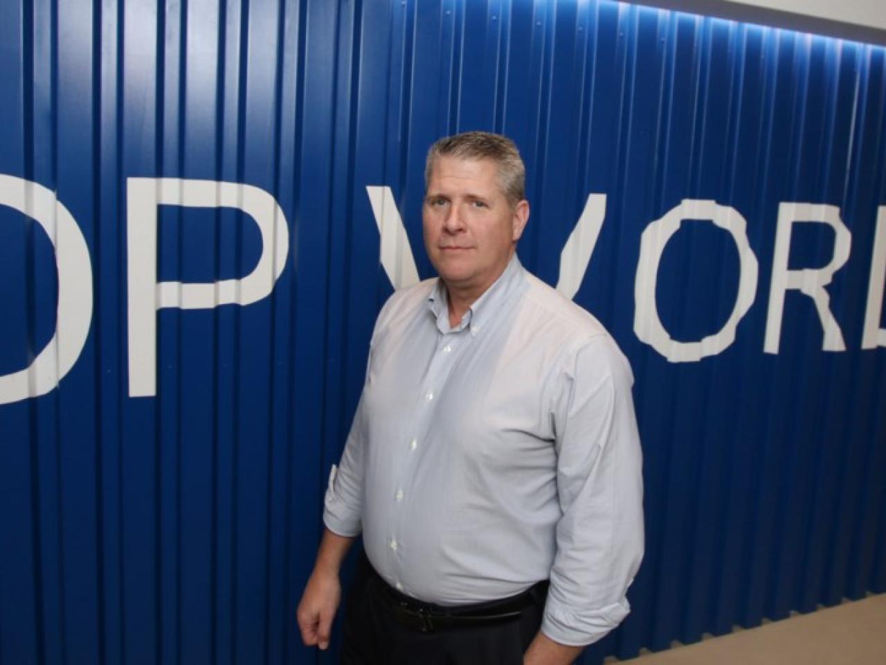 Doug Smith stands in DP World entryway at the company's office in the Vancouver metro area.