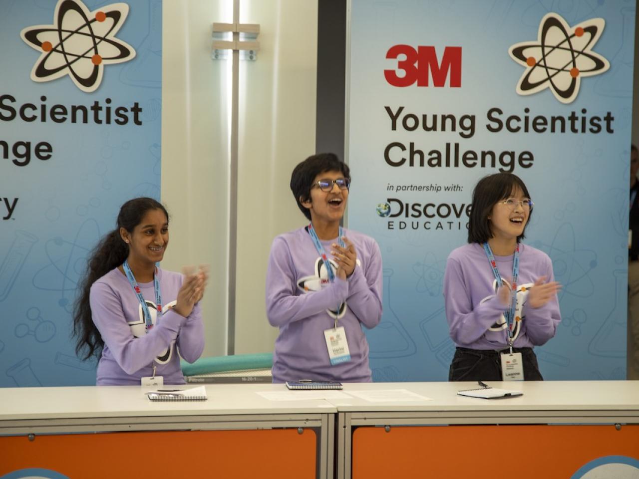 3M Young Scientist Challenge. Three student shown on a panel.