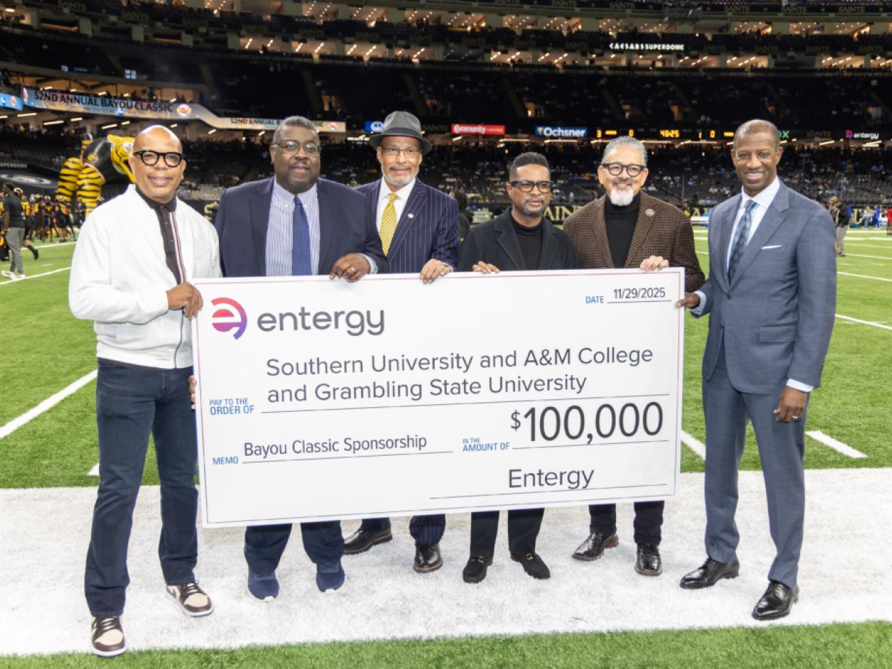 group holding up large check