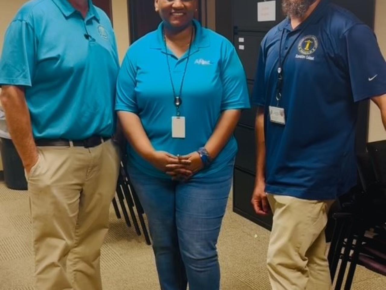 Aflac volunteers shown with representatives from the Chattahoochee Valley school district.