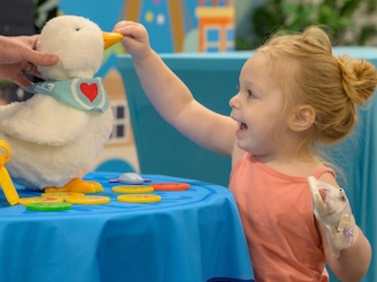 Young patient shown with an Aflac My Special Duck.