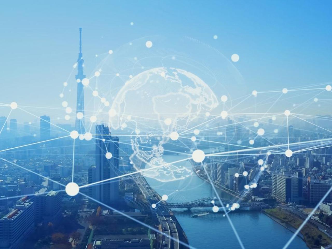 Transparent globe and web over a city skyline