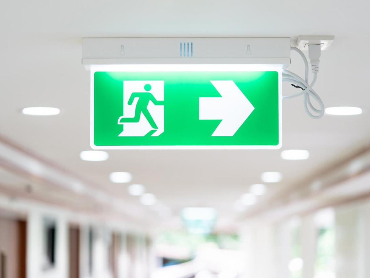 Illuminated green emergency exit sign