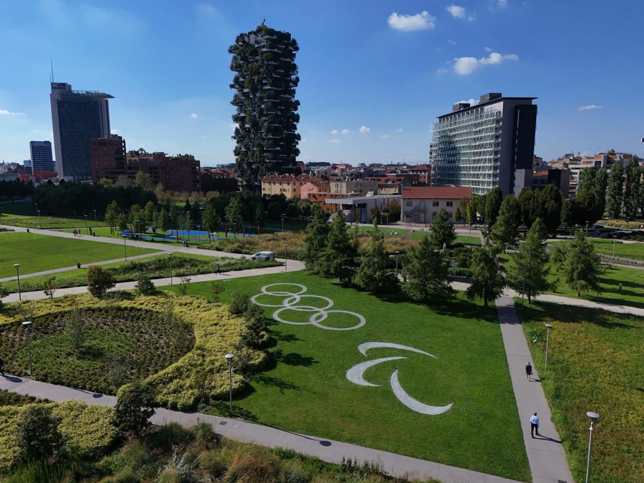 A performing land art installation featuring the Olympic rings and Paralympic Agitos