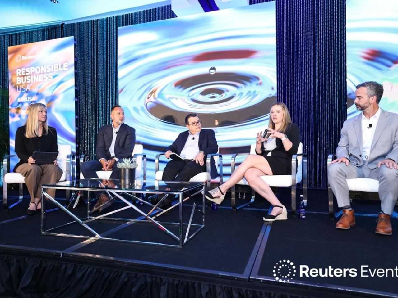 Panelists lead discussion on stage