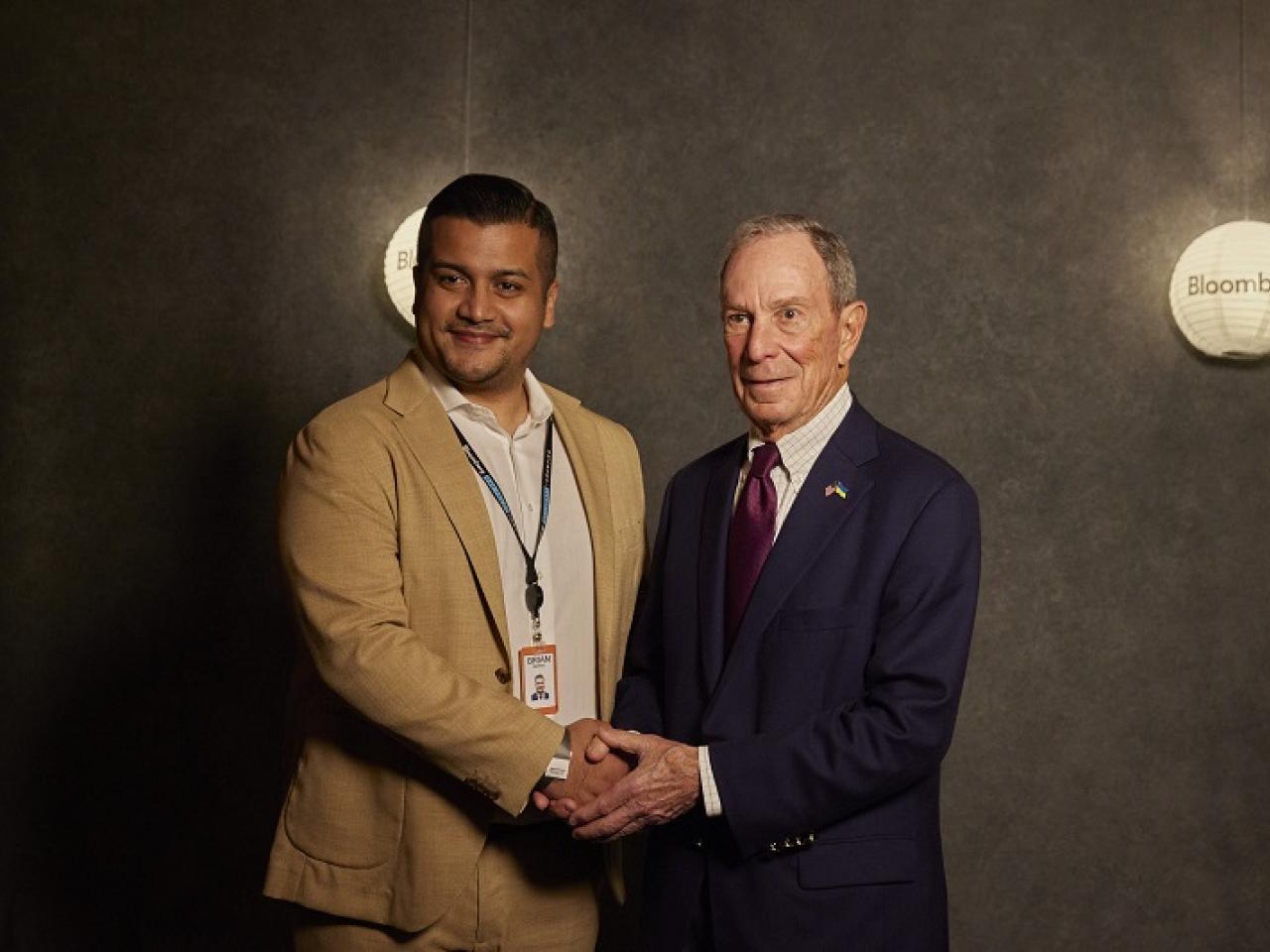 Two people shaking hands for a photo