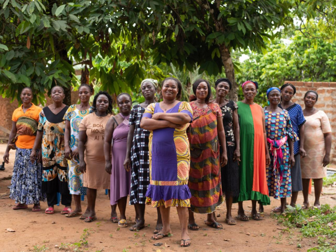 Group of women in a Ghanaian Village Savings and Loan Association stand together