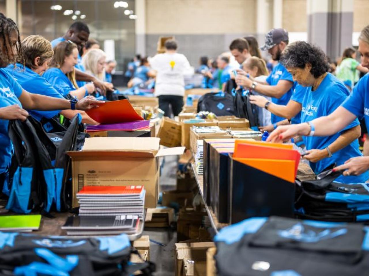 volunteers packing backpacks