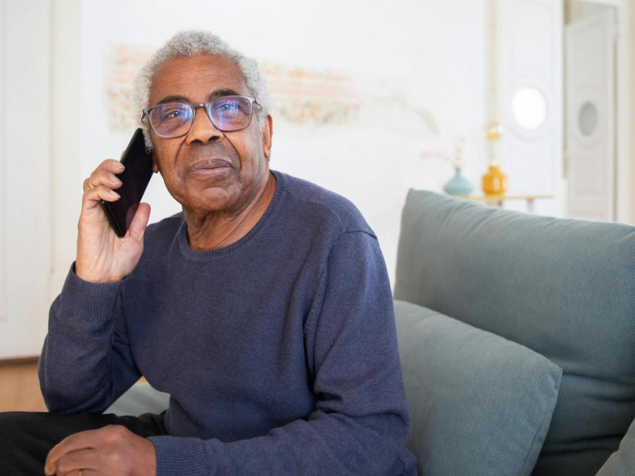 Older gentleman on the phone.