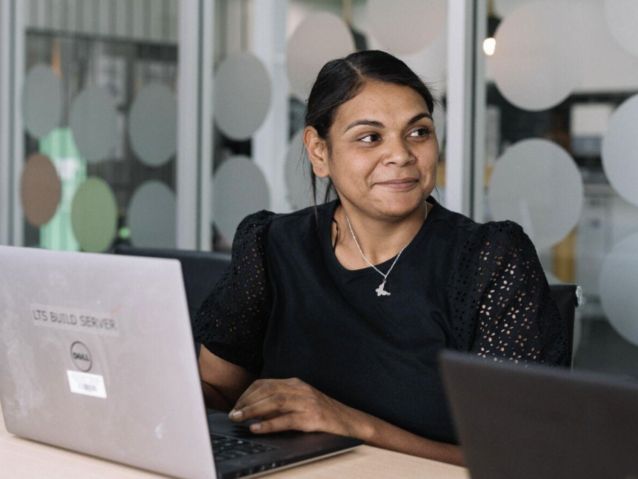 Woman on laptop in office
