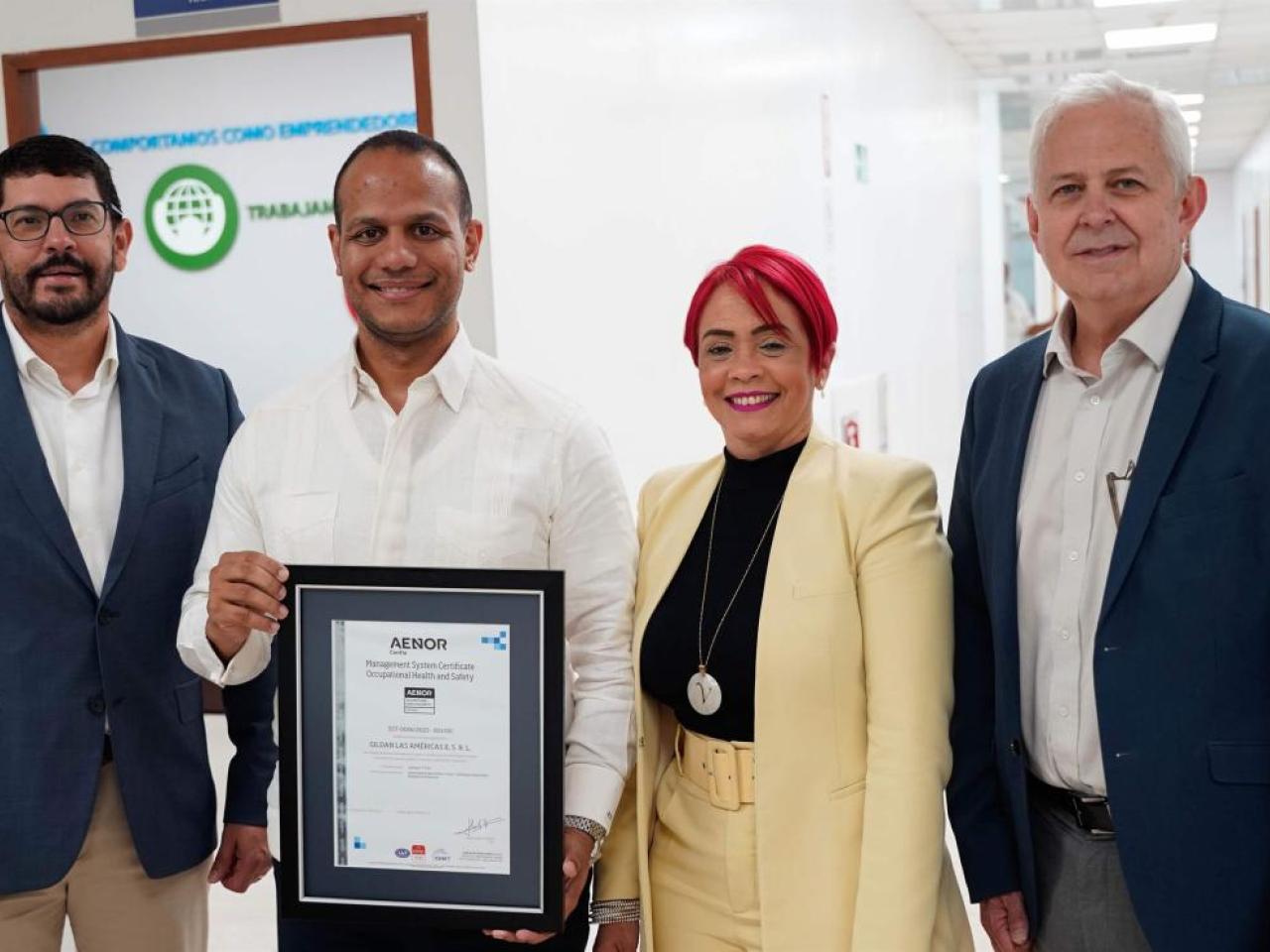 Four Gildan representative holding Gildan's first ISO 45001 Certification