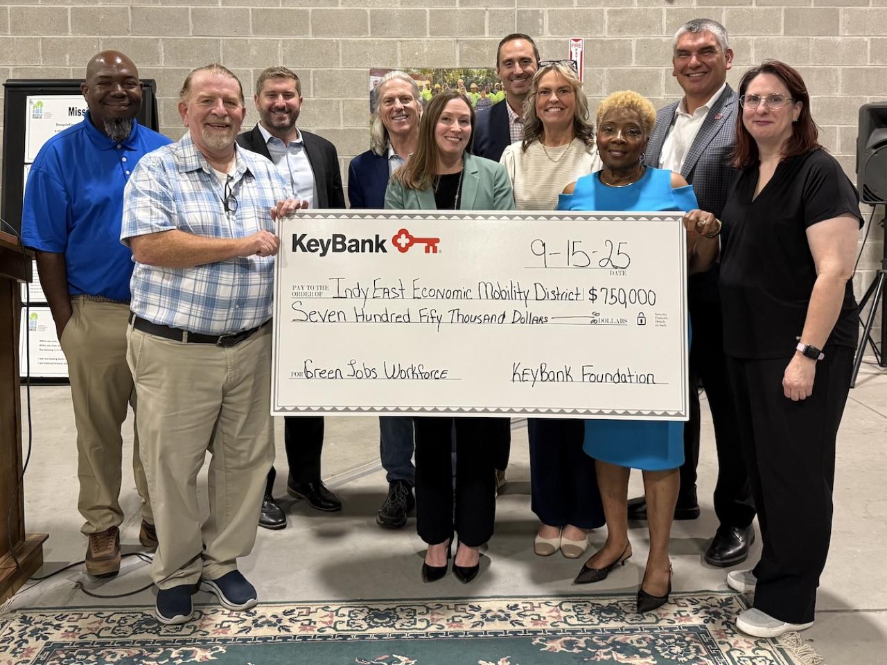 Representatives from KeyBank and IndyEast shown with a $750,000 grant check.