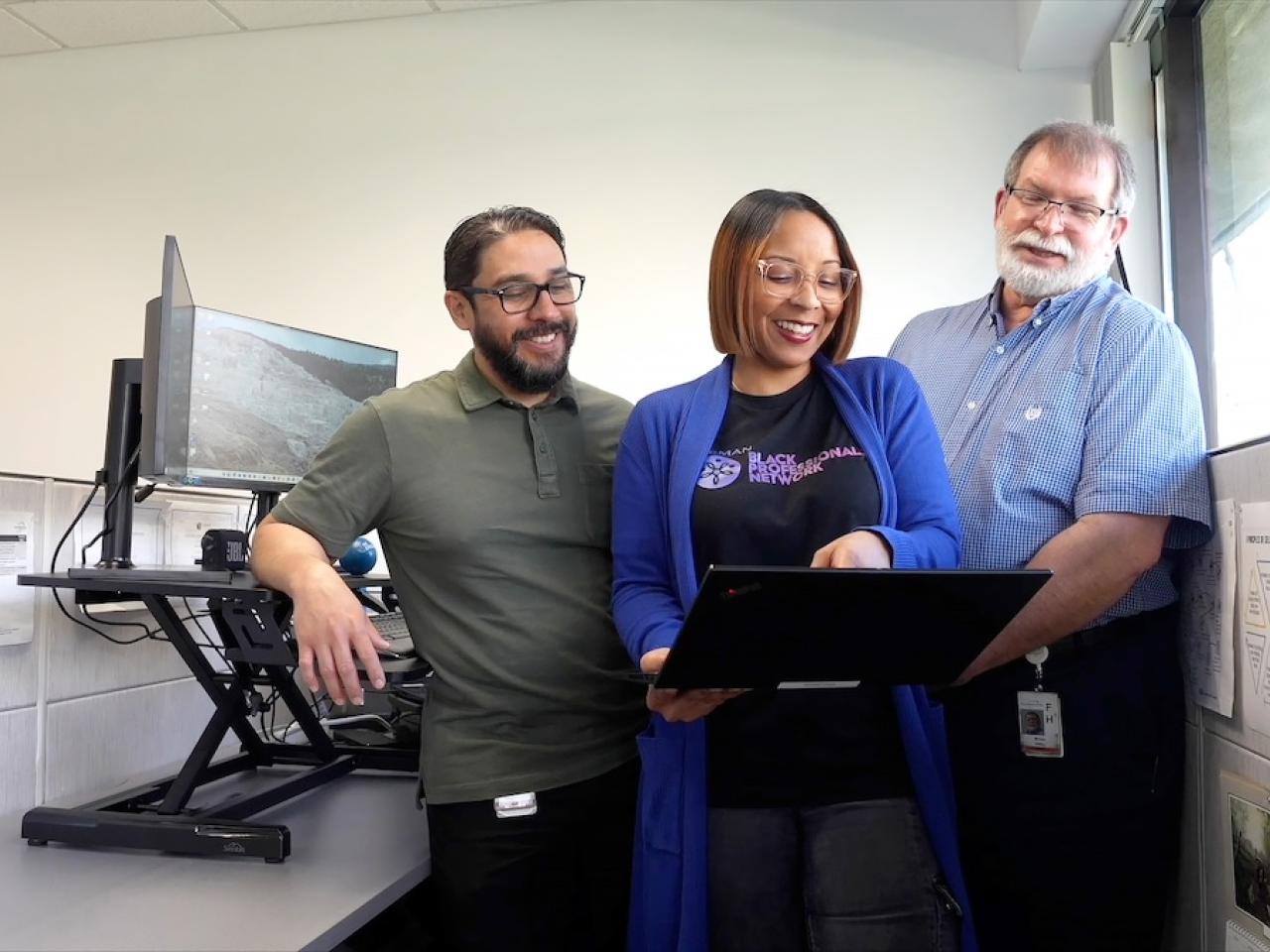 HARMAN Engineer Kelly with coworkers.
