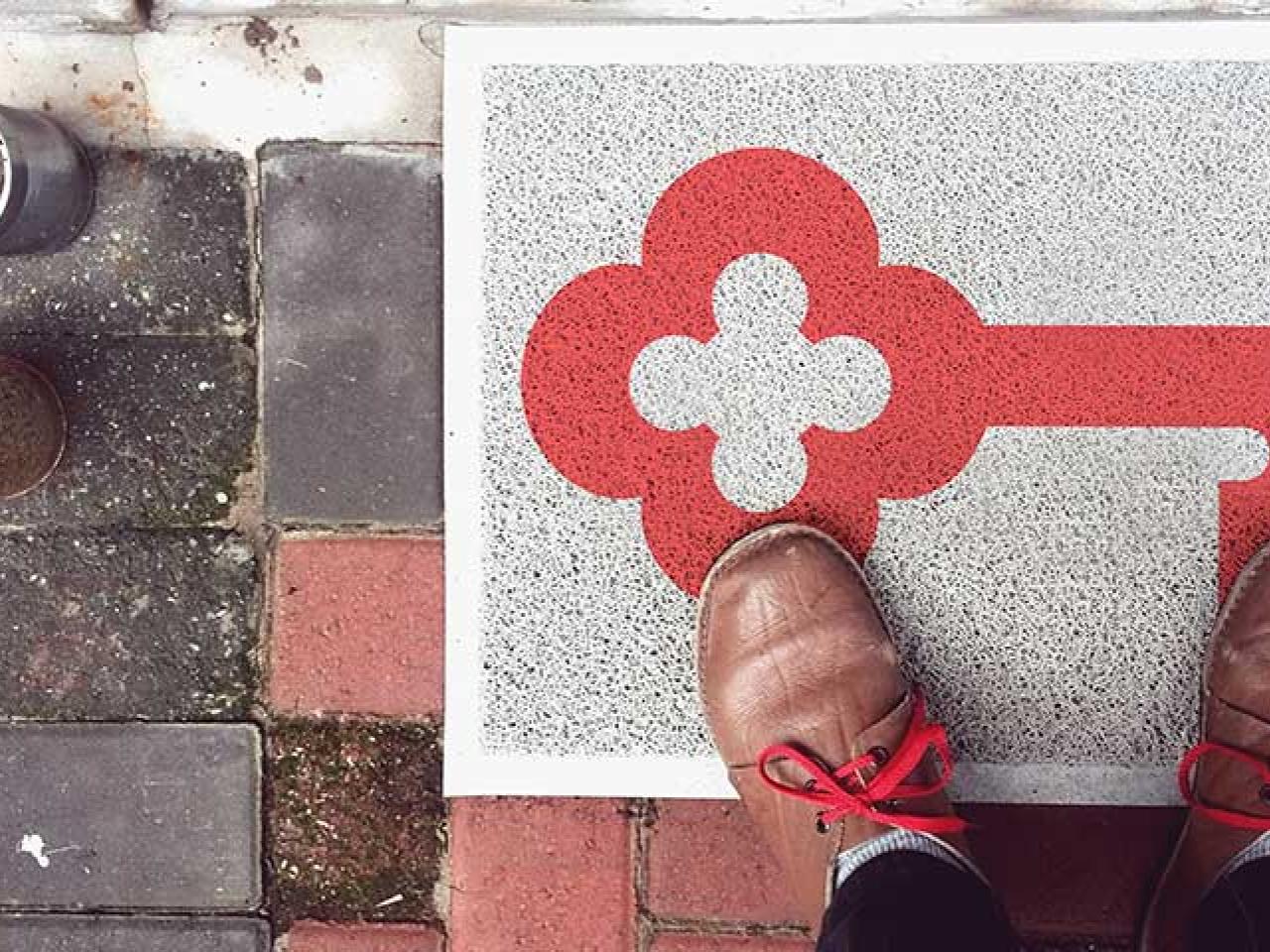 KeyBank logo on a doormat welcoming a person into a home.