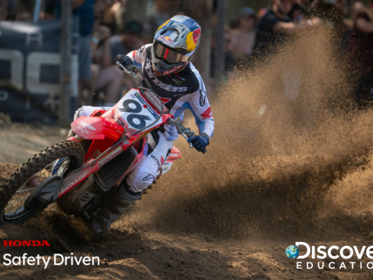 Red motorcycle driving down track
