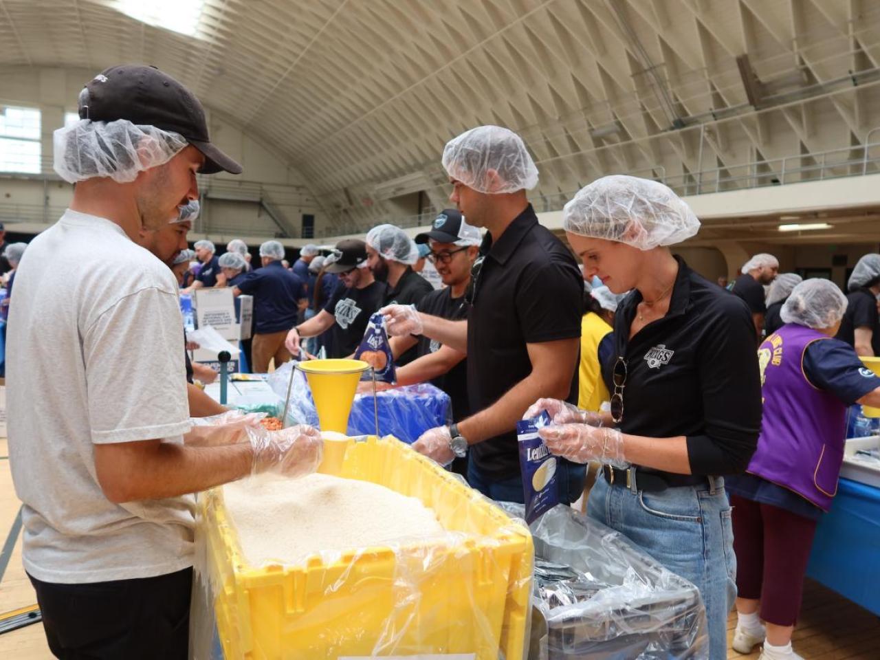 Volunteers from the LA Kings and Blue Shield of California gathered at the LAFD Frank Hotchkin Memorial Training Center to assemble meal kits for families in need.
