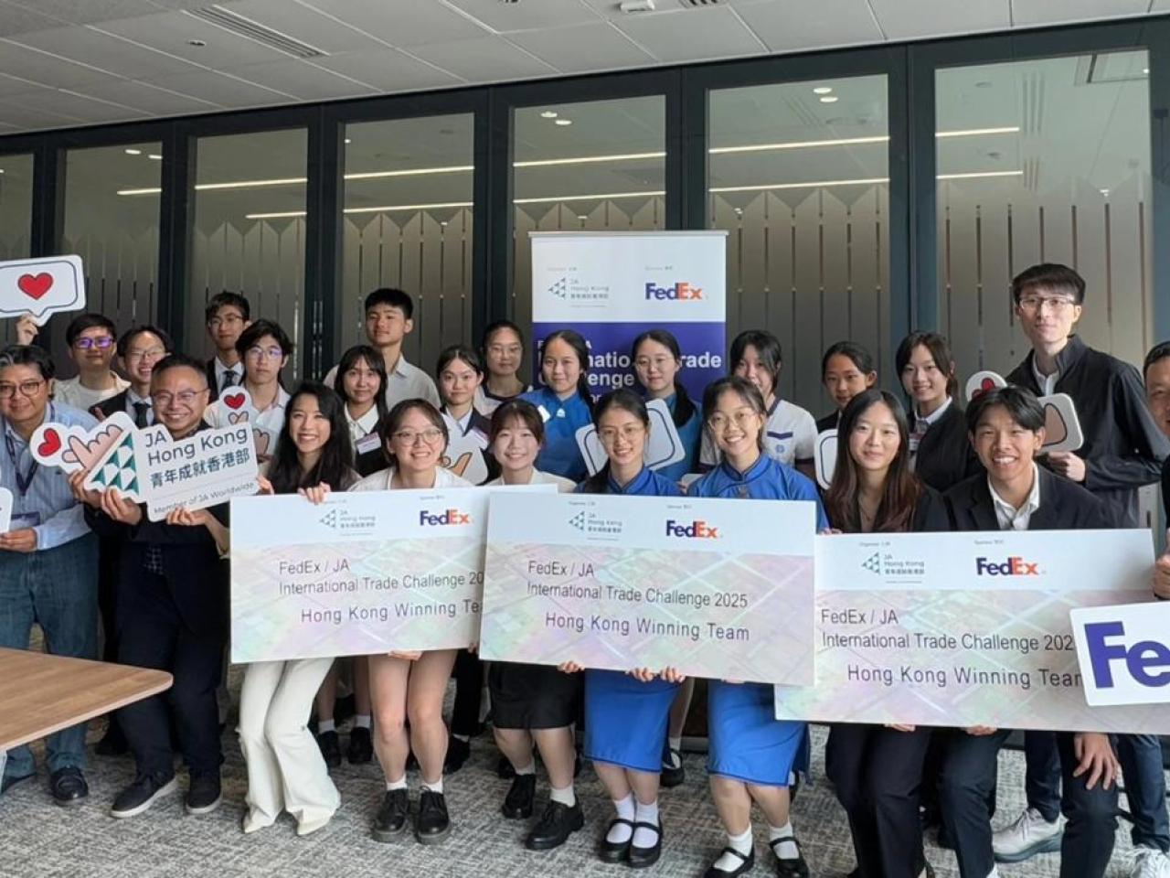 Group of students holding FedEx awards