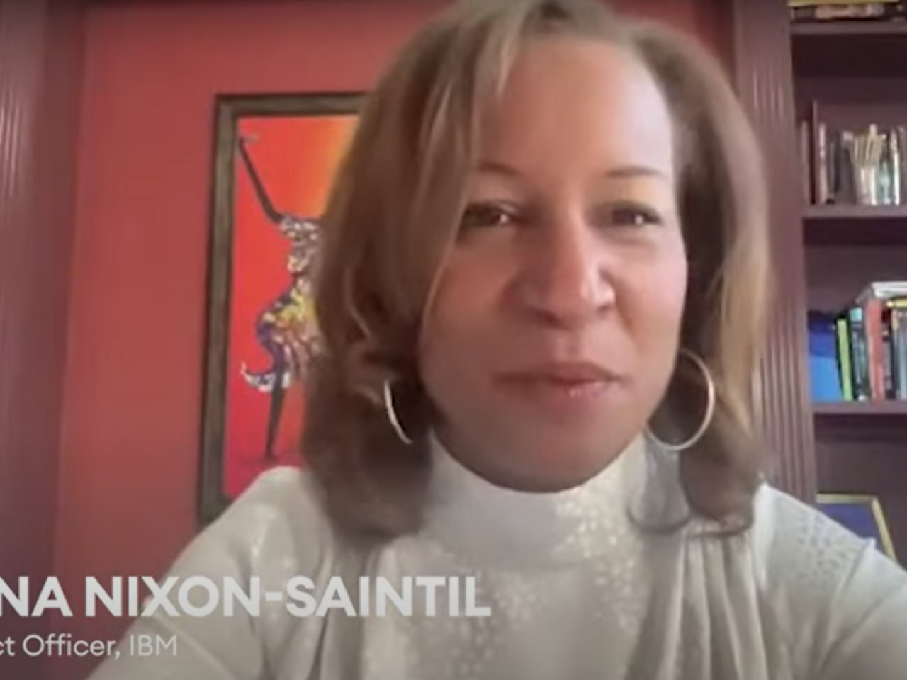 Justina Nixon-Saintil sitting in a home office setting