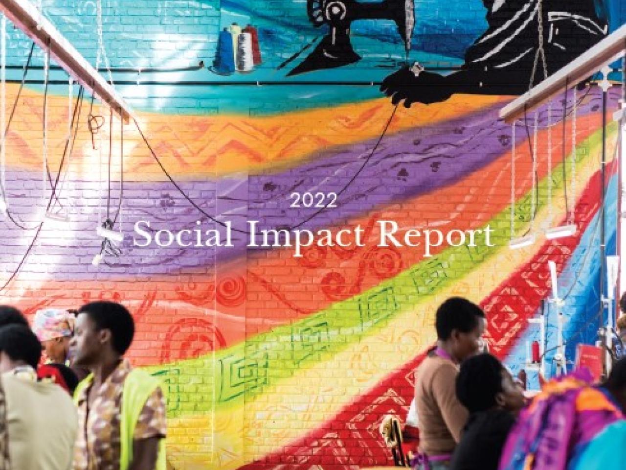 image of women sitting in rows at a sewing factory with a colorful wall in the background