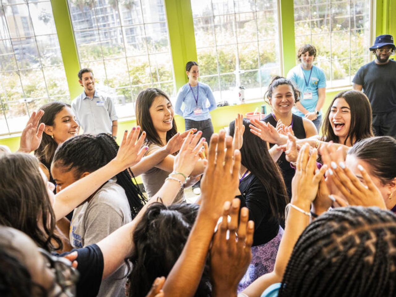 Live Más Scholarship recipients high fiving